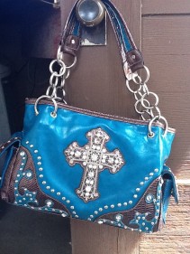 teal purse with cross