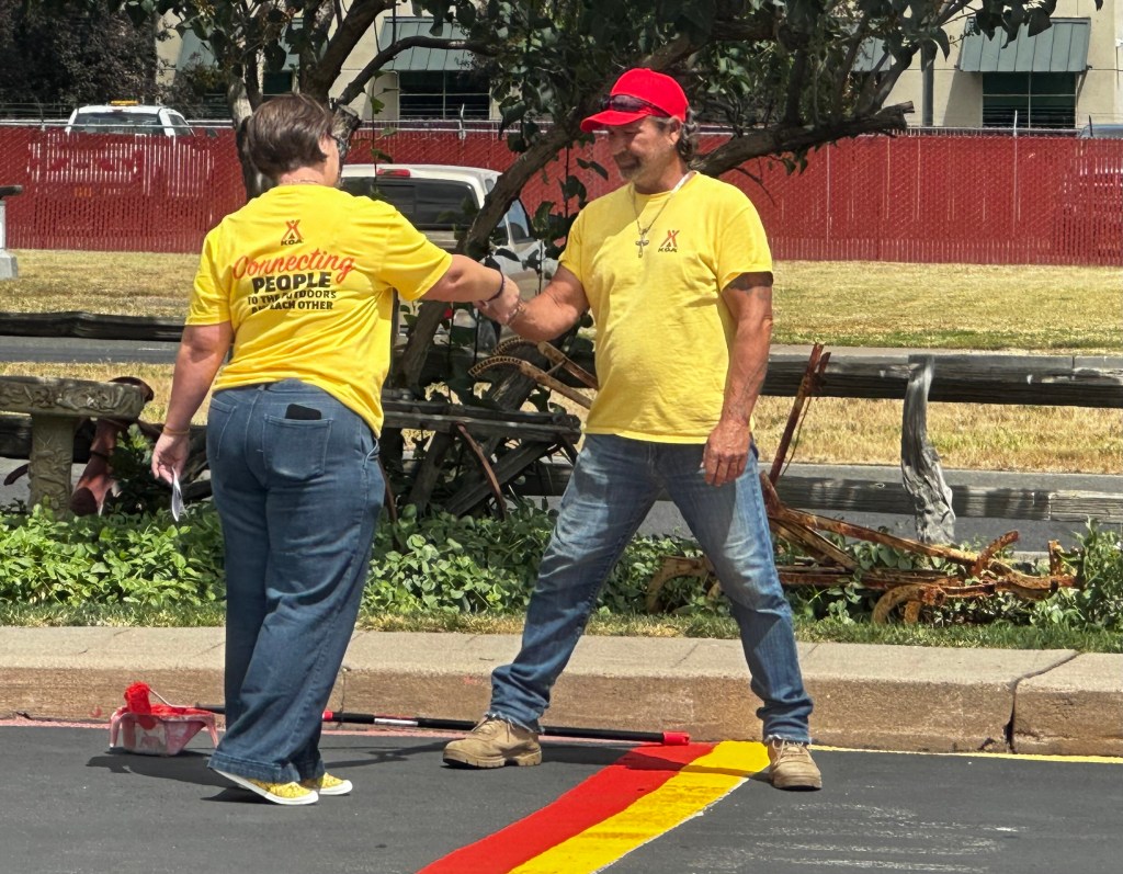 workers fist-bumping