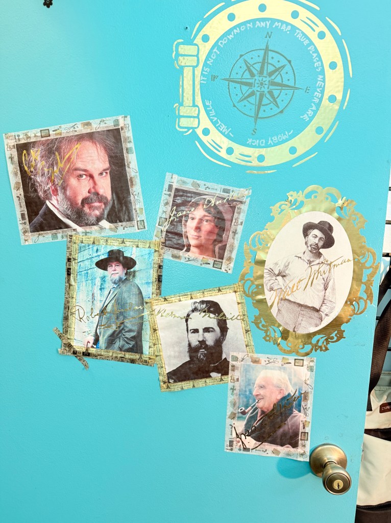 photo of the writer's office door with pictures of her favorite writers