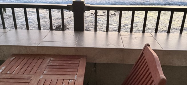 a balcony above the waves