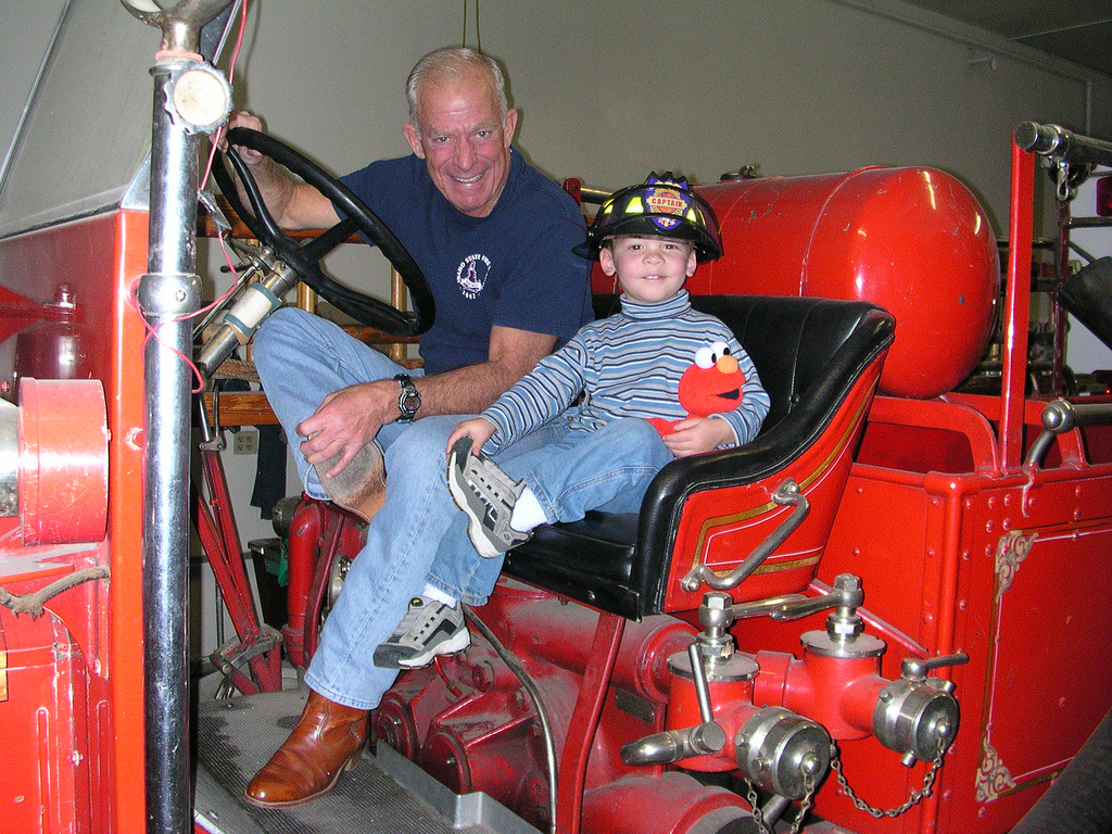 Bob and the writer's son (with Elmo) on an old-fashioned fire engine