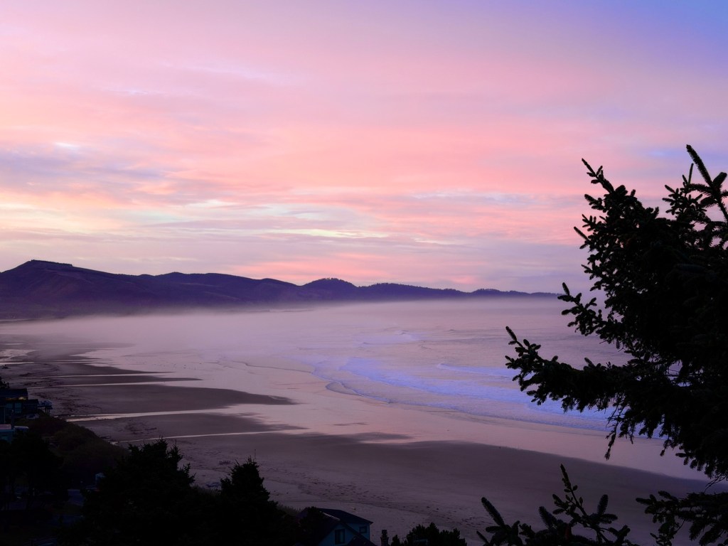 sunset over an ocean bay